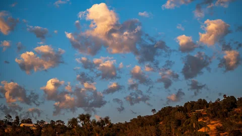 Late Afternoon Clouds Change to Red as the Twilight Approaches Stock Footage 283443197