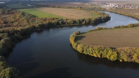 Late autumn, empty trees, field. The big river flows through the banks Stock Footage 193985238