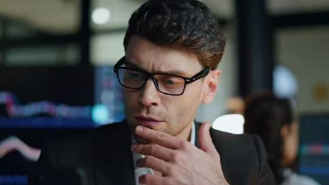 Late businessman thinking problem solution closeup. Serious man trader checking Foto stock