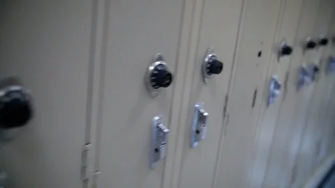 Late to Class Running Past Lockers in High School Slow Motion Stock Footage 124344941
