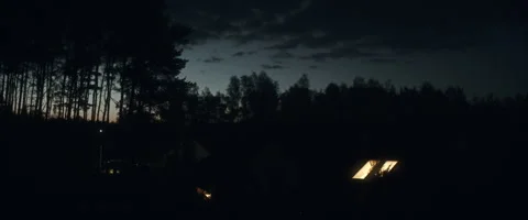 Late evening over forest and houses anamorphic Stock Footage 242864977