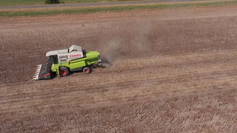 Late harvest machine on dry plot, Long Aerial View Stock Footage 346340185