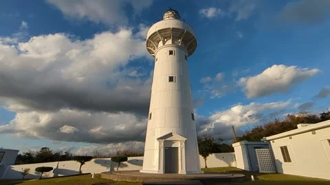 Late light on white lighthouse, handheld motion shot Stock Footage 295241650
