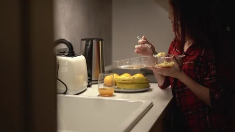 Late Night Dining A Womans Evening Snack in the Kitchen can be a delightful Stock Footage 289965436