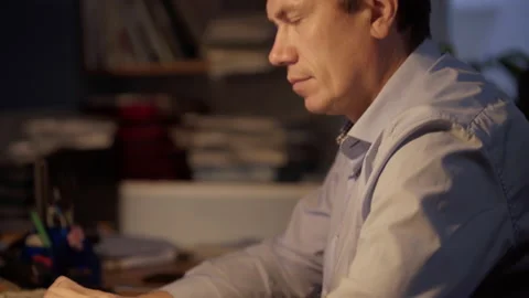 Late at Night in the Office. Design Engineer Works on His Personal Computer Video stock 131014990