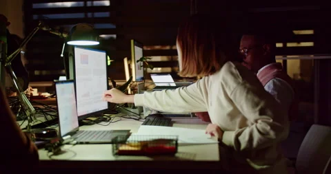 Late night teamwork between multi generational people for business growth and Stock Footage 275291599