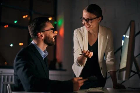 Late night working routine at the office. Stock Photos