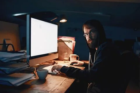 Late nights are normal for a programmer. Cropped portrait of a young computer Stock Photos
