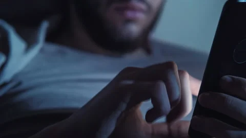 Late online chat sleepless night man hand phone Stock Footage 132001129