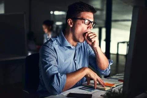 The late shift can get exhausting. Cropped shot of a young attractive Stock Photos