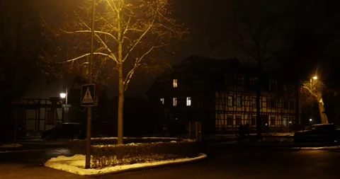 Late silent night scenery at dark street in Braunschweig Riddagshausen.  Stock Footage 258366341