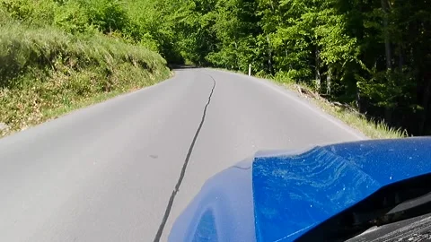 Late spring downhill road ride through forested area in Stiavnica Mountains Stock Footage 334509990
