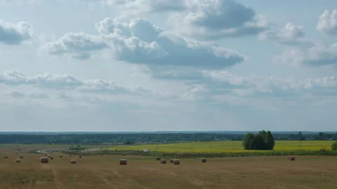 Late summer landscape of fields, road and moving clouds, time lapse Stock Footage 282695108