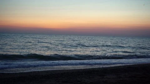 Late sunset on the sandy seashore. 4k footage Stock Footage 162020424
