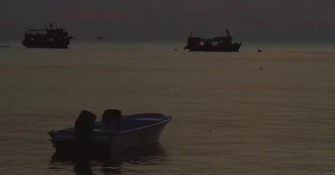Late sunset shot of a boat floating on water Stock Footage 72393727