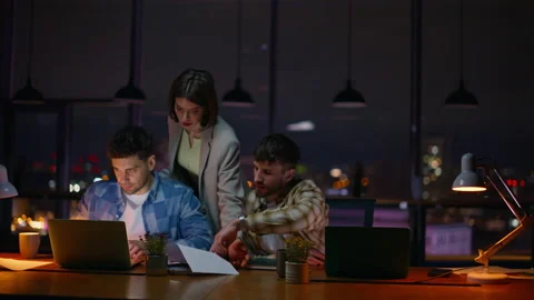 Late teammates looking solution working creative evening office. People deadline Stock Footage 339299416