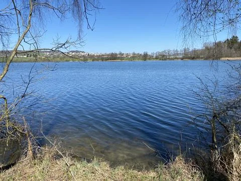 Late winter and early spring on the lake Mauensee or Lake Mauen (Mauesee) 写真素材
