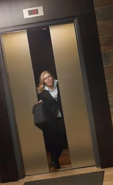 Late For Work-Getting Off Elevator Stock Photos