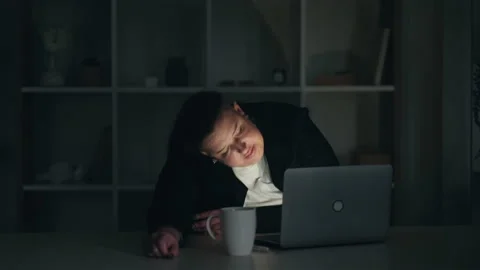 Late work job pressure deadline female snoozing Stock Footage 157485013