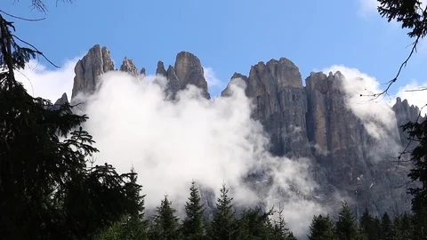 Latemar dolomites mountains with clouds and forest Italy Stock Footage 71250533