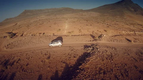 Lateral aerial view of a 4 by 4 car crossing the desert. Spain. 4k Stock Footage 44790457