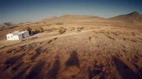 Lateral aerial view of a 4 by 4 car through the desert. Spain. 4k Stock Footage 47330494