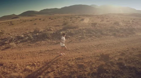 Lateral aerial view of a runner at desert. Spain. 4K Stock Footage 52445741