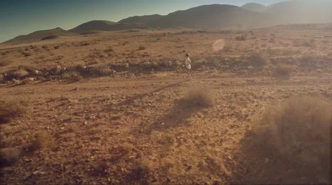 Lateral aerial view of a runner at desert. Spain. 4K Stock Footage 52447692