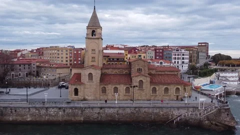 Lateral and close-up flight to discover San Pedro Church. Gijon. Asturias. Spain Video stock 152770078