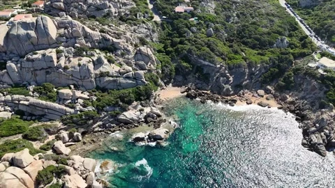 Lateral Drone Flight Over Turquoise Beach and Rocky Coast in Capo Testa, Stock Footage 332266288