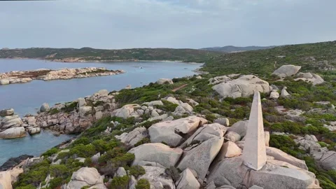 Lateral Drone Flight Past Stone Lighthouse Over Rocky Coast Sardegna Sun Vídeo Stock 333577501