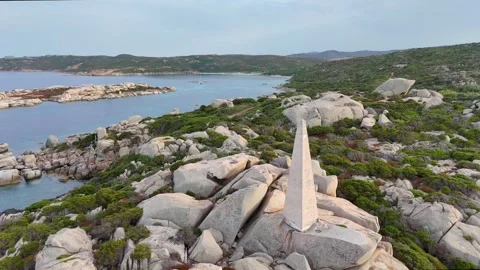 Lateral Drone Passing Lighthouse with Waves and Rocks Sardegna Sunset Stock Footage 333634979