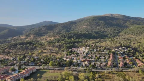 Lateral drone view of hillside homes at sunset Stock-Footage 330924802