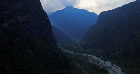 Lateral flight of a drone over the Vallemaggia valley flying, evening light Stock Footage 113750382