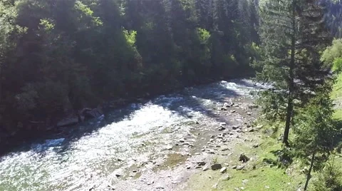 Lateral flight over  mountain river at low height .Aerial Stock Footage 65399249