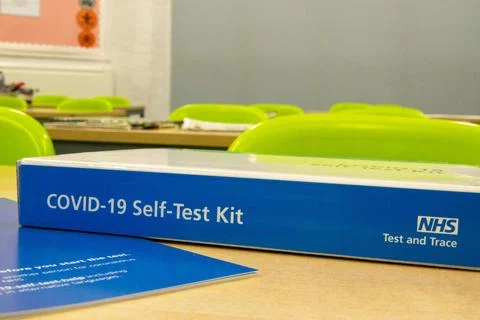 Lateral flow test box and leaflet on a classroom table in a school Stock Photos