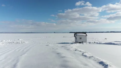 Lateral mid-air drone flight showing first the kitesufer on the ice, Stock-Footage 164382328
