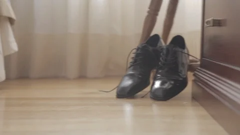 Lateral movement of the camera of some very elegant men shoes black Видео 105821780