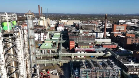 Lateral pass by chimneys and heavy plant structures Stockbeeldmateriaal 343736290