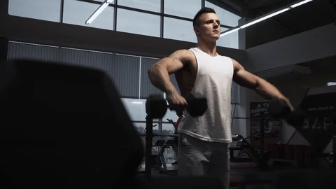 Lateral raise with dumbbells Stock Footage 117909265