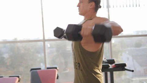 Lateral raise with dumbbells Video stock 118072978