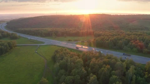 The lateral shot over the forest and the road. Stock Footage 111997670