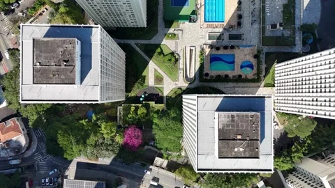 Lateral tracking drone shot showcasing luxury residential buildings with Vídeo Stock 341663730