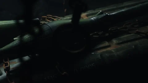 Lateral tracking shot of bombshells, with chains in the foreground, and a red Stock Footage 337727003