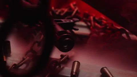 Lateral tracking shot of a kalashnikov barrrel in macro, arsenal, with red Stock Footage 337727053