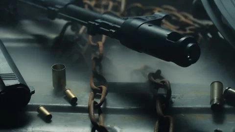 Lateral tracking shot of weapons arsenal stockpile (pistol, kalashnikov Stock Footage 337745731