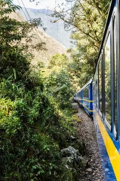 Lateral view of train in motion in the nature. Railway train travel tourism Stock Photos