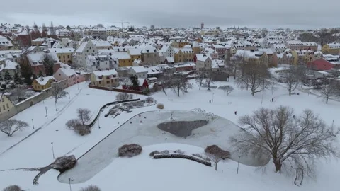 Lateral Winter Drone Flight Over Almedalen Park Toward Visby Stock Footage 330027930