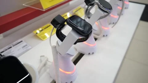 The latest models of smart watches on display at a hardware store Stock Footage 304807874