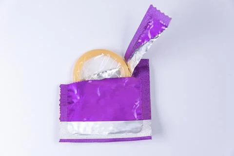 Latex condom on white background Stock Photos